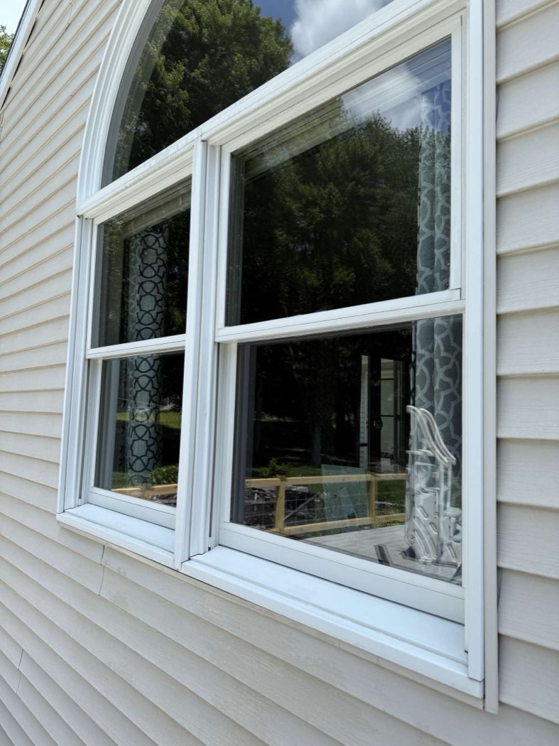 Clean arched window overlooking a pool
